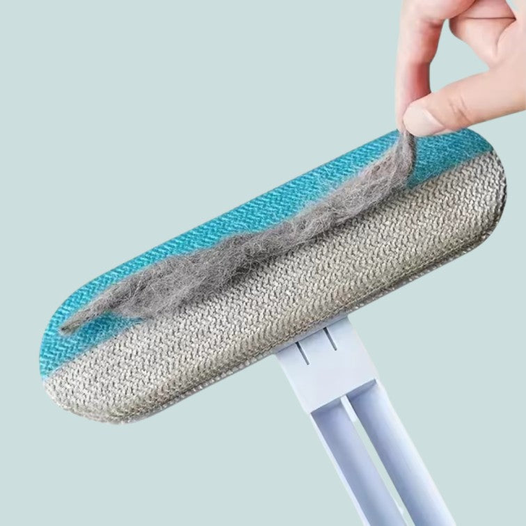 Cleaning tool with a replaceable head on a light blue background